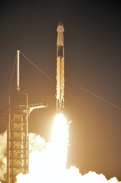 Falcon 9 launching with Crew Dragon at night, from a public domain USAF photo