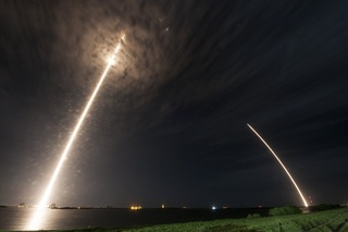 Streak shot of a Falcon 9 rocket launching and landing at Cape Canaveral Space Force Station